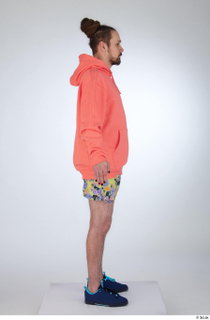 Nigel a-pose blue sneakers dressed floral printed shorts salmon hoodie…